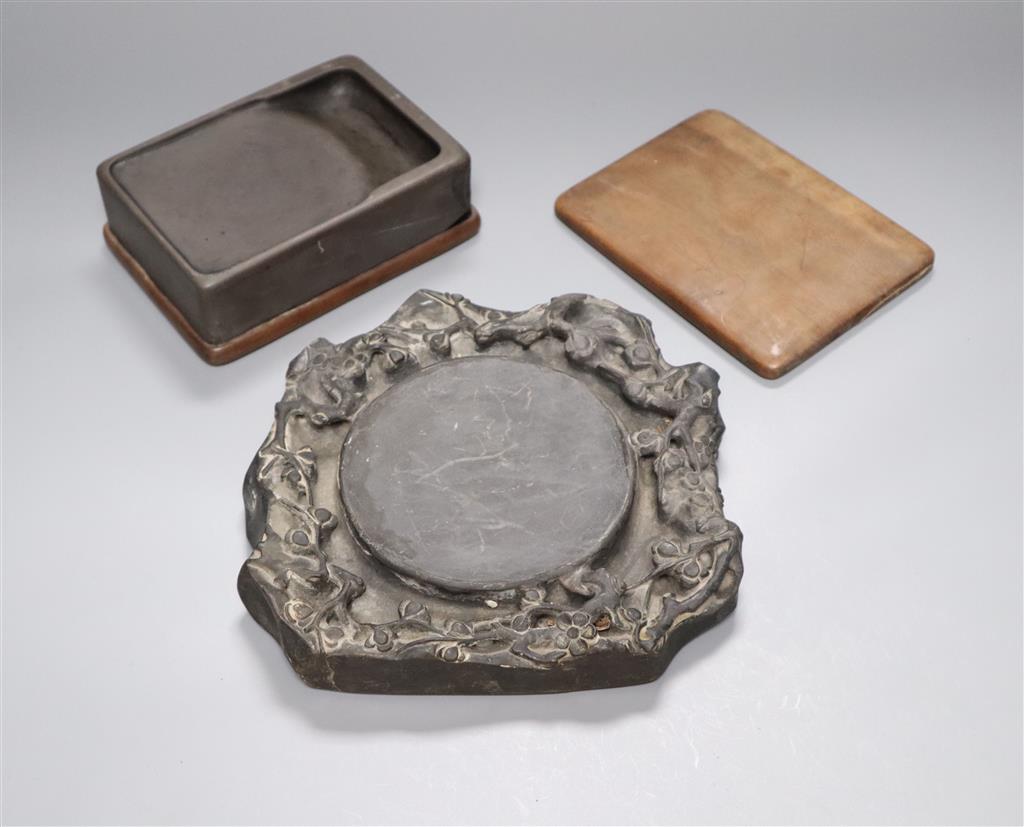 A 19th century Chinese black slate inkstone and another with wood base and cover